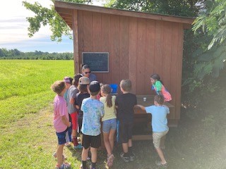 Kids Weighing Veggies